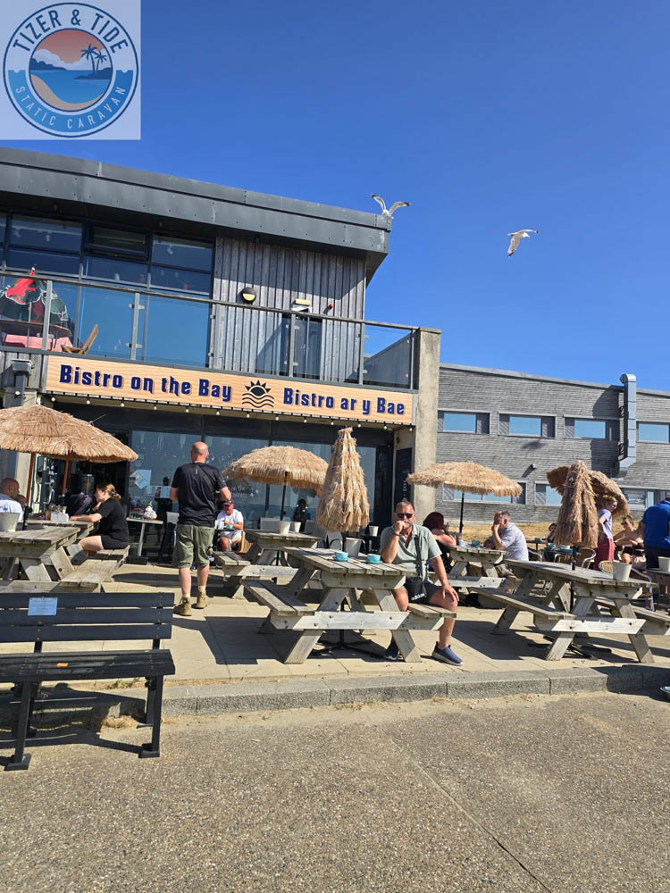 Beachfront bar with parasols on the sand