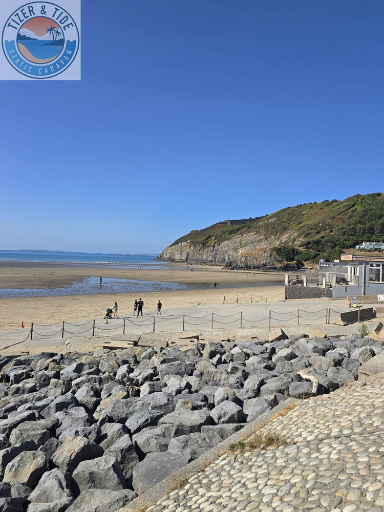 Wide sandy beach with a row of beach huts