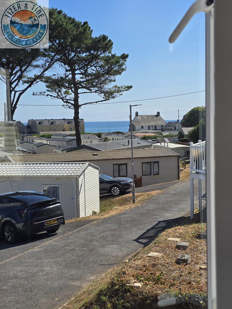 View from the caravan across the holiday park rooftops to the sea