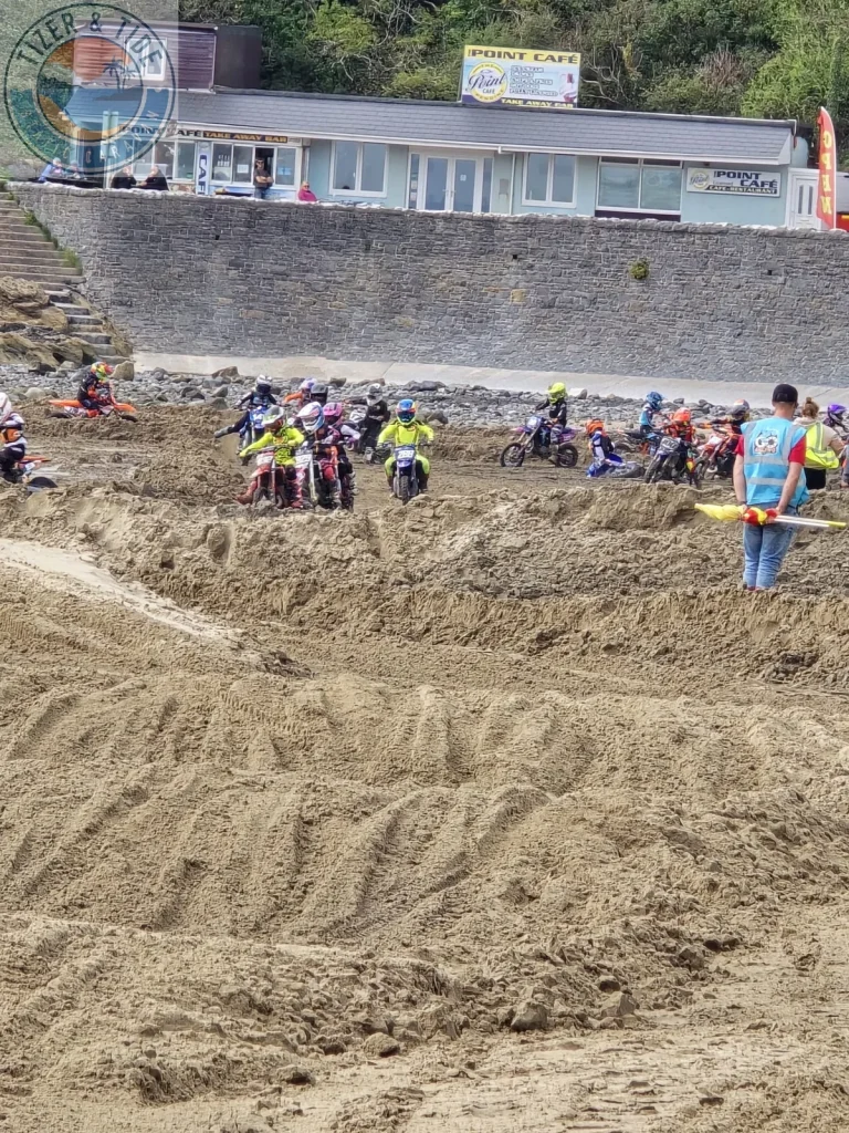Riders lined up for the start of a beach motocross race at Pendine